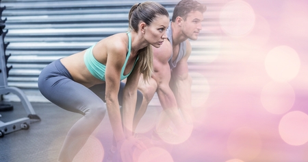 Digital composite of Woman and man exercising in gym