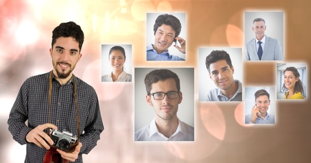 Digital composite of Confident male photographer holding camera by flying business portraitsの写真素材