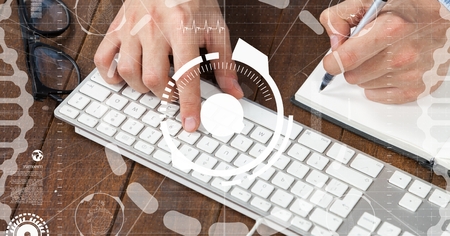 Digital composite of Hands using computer keyboard while writing