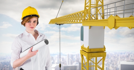 Digital composite of Female architect holding plan by craneの写真素材