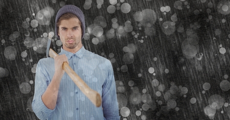Digital composite of Confident hipster holding ax on rainy dayの写真素材
