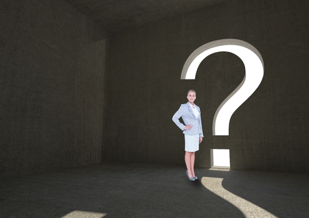 Digital composite of Businesswoman standing by question mark shape doorwayの写真素材