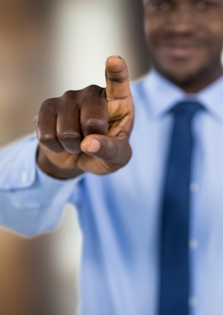 Digital composite of Businessman pointing at screenの写真素材