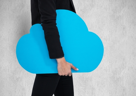 Digital composite of Midsection of businesswoman holding blue cloud shape