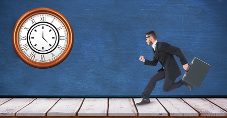 Digital composite of Businessman running with clock mounted on wall