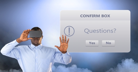 Digital composite of Businessman wearing VR glasses by confirm boxの写真素材