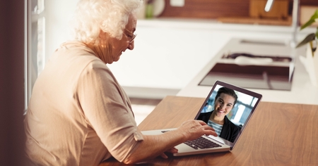 Digital composite of Senior woman video conferencing on laptopの写真素材