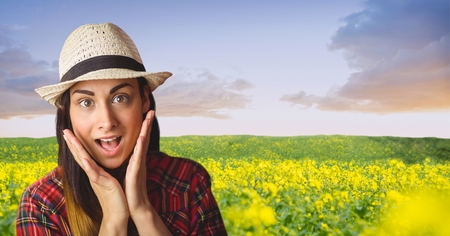 Digital composite of Surprised hipster standing on farm against sky