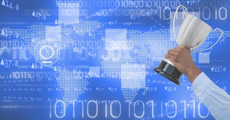 Digital composite of Digital image of hand holding trophy against binary codeの写真素材
