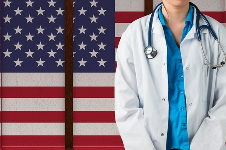 Digital composite of doctor against american flagの写真素材