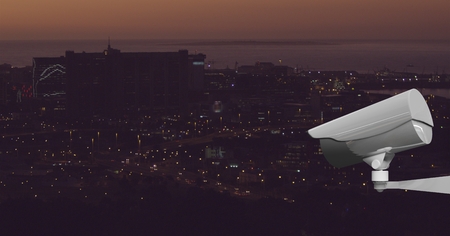 Digital composite of back of CCTV controlled the city at night
