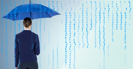 Digital composite of Back of business woman with umbrella against blue background and blue codeの写真素材
