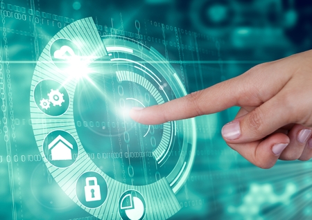 Digital composite of Hand touching interface in technology illuminated background