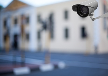 Digital composite of cctv in front of a building (blurred)の写真素材
