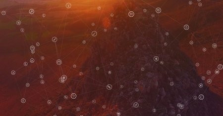 Digital composite of White network against mountain rock in sunset