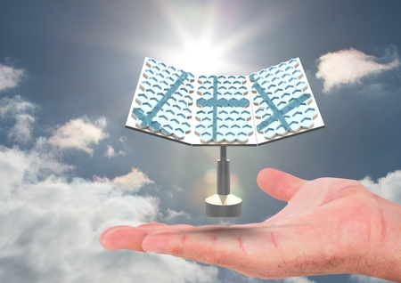 Digital composite of solar panel on hand in the skyの写真素材