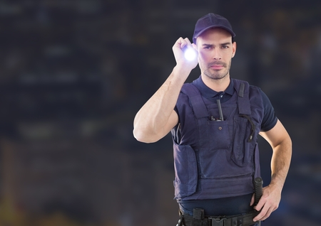 Digital composite of Security man outside in night cityの写真素材