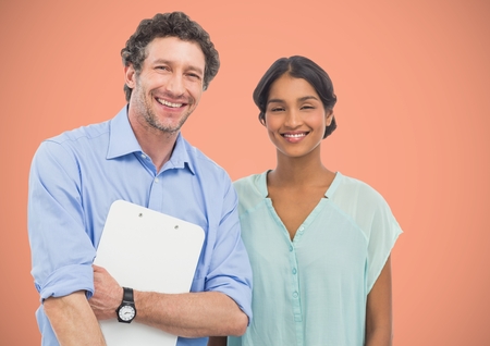 Digital composite of Two people smiling to the photo with a salmon backgroundの写真素材