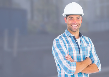 Digital composite of Construction Worker in front of construction siteの写真素材