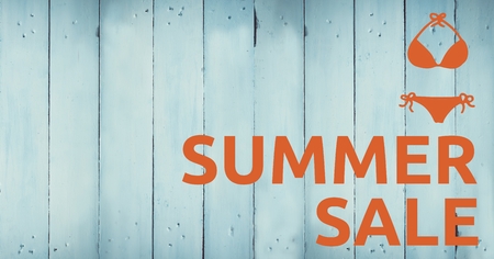Digital composite of Orange summer sale text and bikini graphic against blue wood panelの写真素材