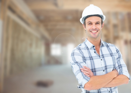 Digital composite of Construction Worker in front of construction siteの写真素材