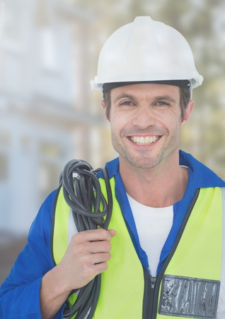 Digital composite of Electrician with wires cables on building site