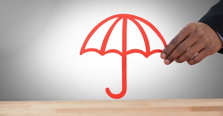 Digital composite of Cut out umbrella in handの写真素材