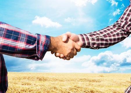 Digital composite of farmers handshake. farmの写真素材