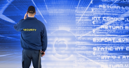Digital composite of Rear view of security guard facing text backgroundの写真素材