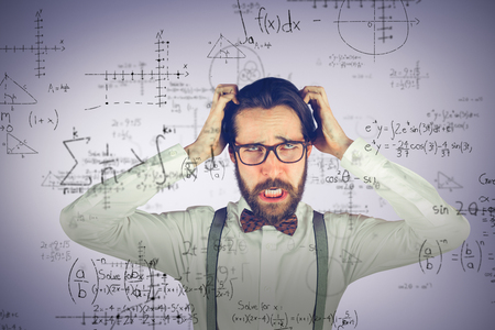 Frustrated man scratching head against grey vignetteの写真素材