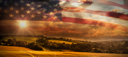 Close-up of American flag against country sceneの写真素材