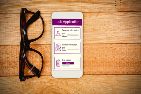 Informations for job application against view of glasses and a smartphoneの写真素材