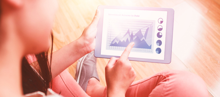 Blue graphics on white background against girl using her tabletの写真素材