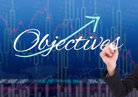 Digital composite of Hand of business person writing OBJECTIVES in the screen with stock market backgroundの写真素材