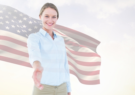 Digital composite of Business woman shaking her hand against american flagの写真素材