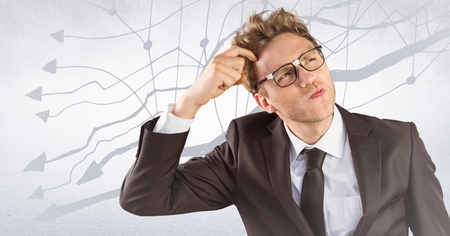 Digital composite of Frustrated business man against white wall and graph