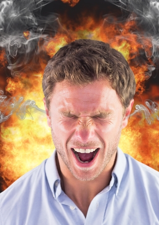 Digital composite of anger man shouting with steam on ears and fire behind him.の写真素材