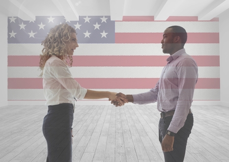 Digital composite of Business people shaking their hands against american flagの写真素材