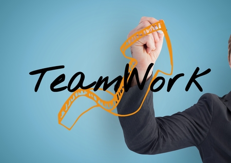 Digital composite of Businessman hand finishing the arrow of the graphic about TEAM WORKの写真素材