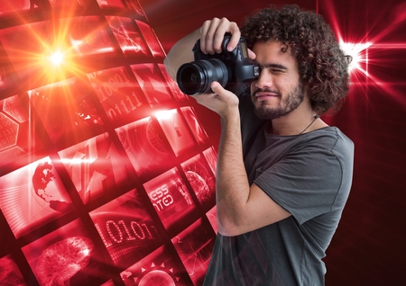 Digital composite of Photographer taking a picture in front of a photo montage frameの写真素材