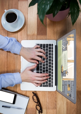 Digital composite of top view of a desk with laptop (with business hands on it), notebook, glasses and coffee. On the scrの写真素材