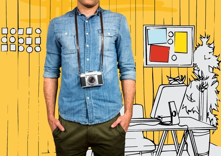 Digital composite of Millennial man mid section with camera against 3D yellow hand drawn officeの写真素材