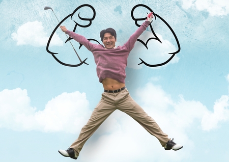 Digital composite of happy man jumping in front of fists in the sky draw on a wallの写真素材