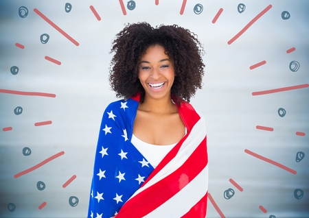 Digital composite of Woman wrapped in american flag against blurry blue wood panel and red blue fireworks doodleの写真素材