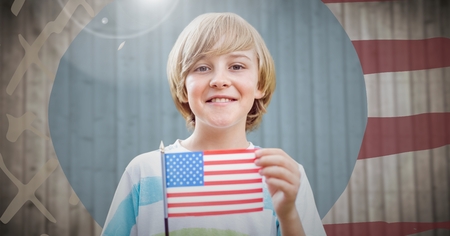 Digital composite of Boy holding american flag against hand drawn american flag with flareの写真素材