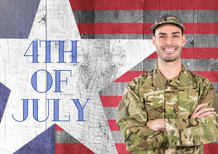 Digital composite of Smiling soldier standing on american flag background