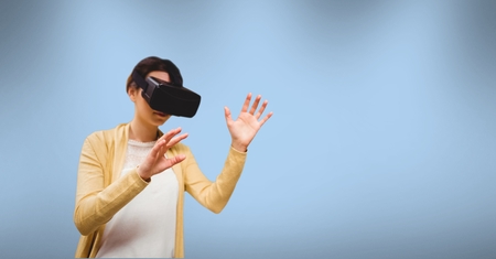 Digital composite of Woman wearing virtual reality headset