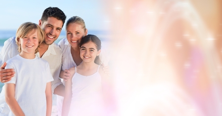 Digital composite of Family at beach with peach transitionの写真素材