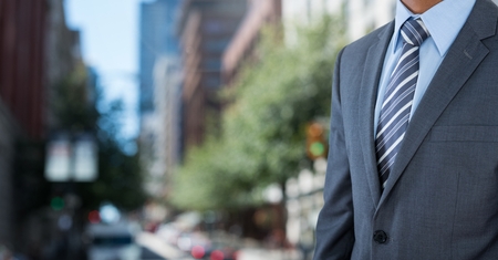 Digital composite of businessman in cityの写真素材