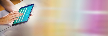 Digital composite of Hand touching tablet with rainbow transition